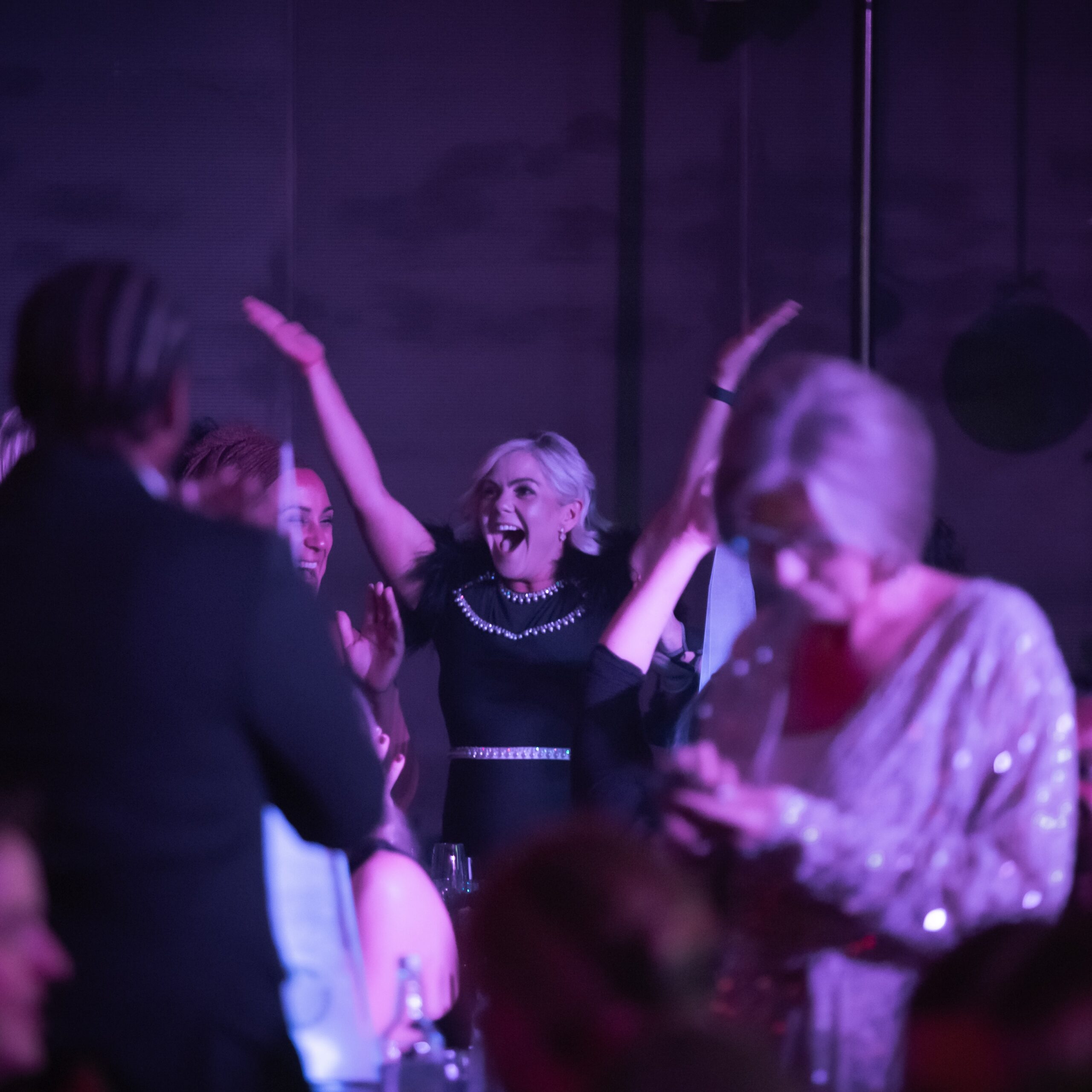 a woman celebrating at the Awards