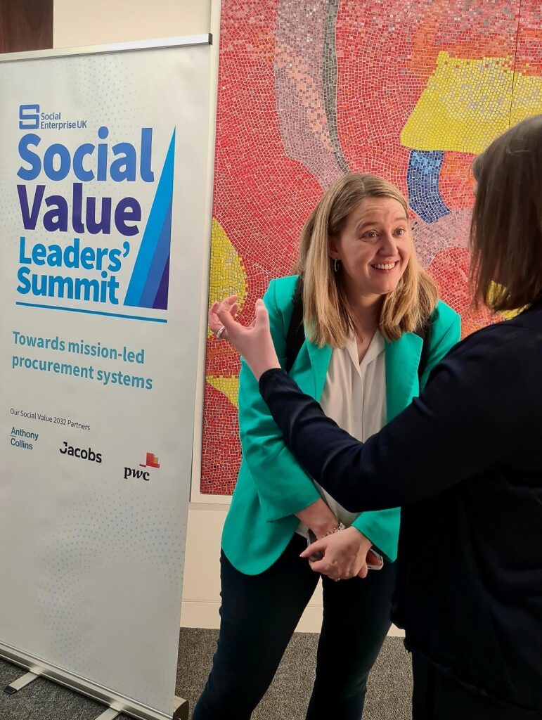 Georgia Gould in front of banner